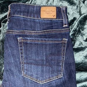 Dark American eagle knee length shorts.